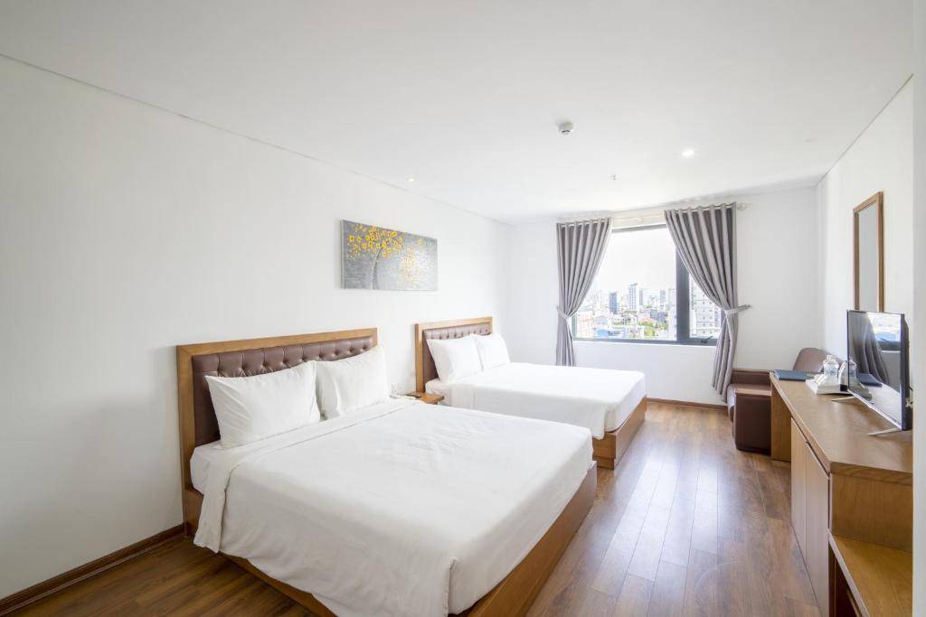 Phòng suite tiện nghi với giường ngủ cao cấp